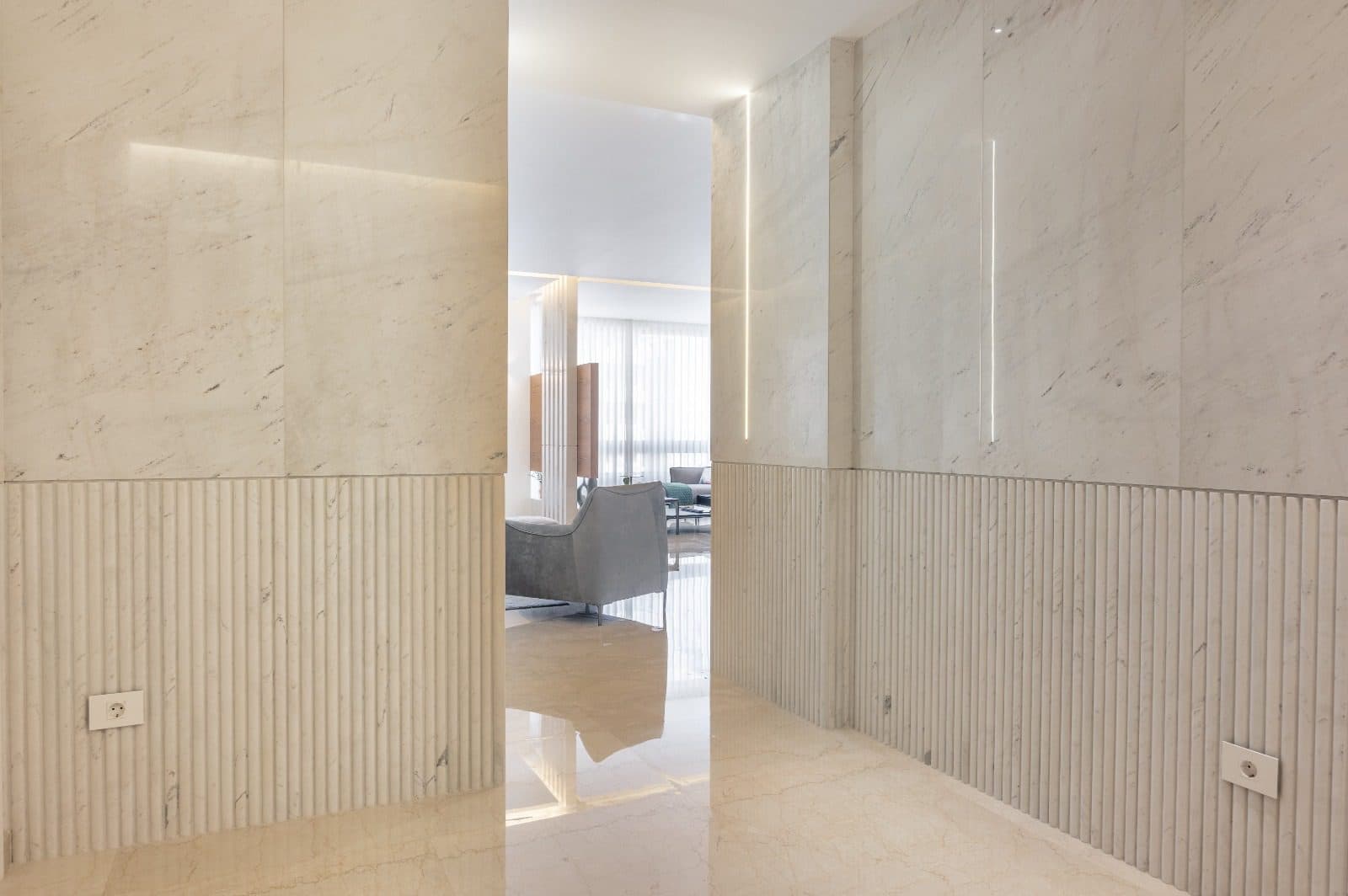 A corridor lined in stone.