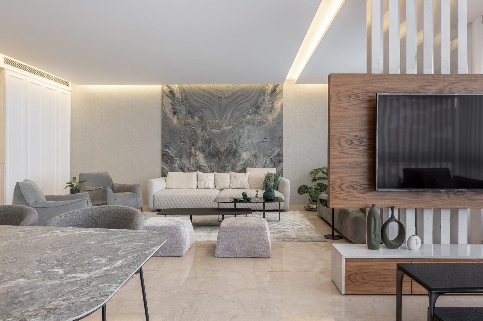A living room in book-matched marble.
