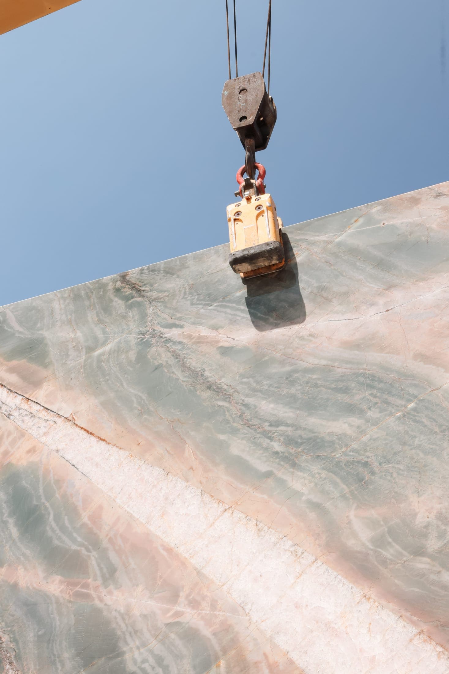 A full slab lifted by the overhead crane at the Zein Group stone yard, Beirut