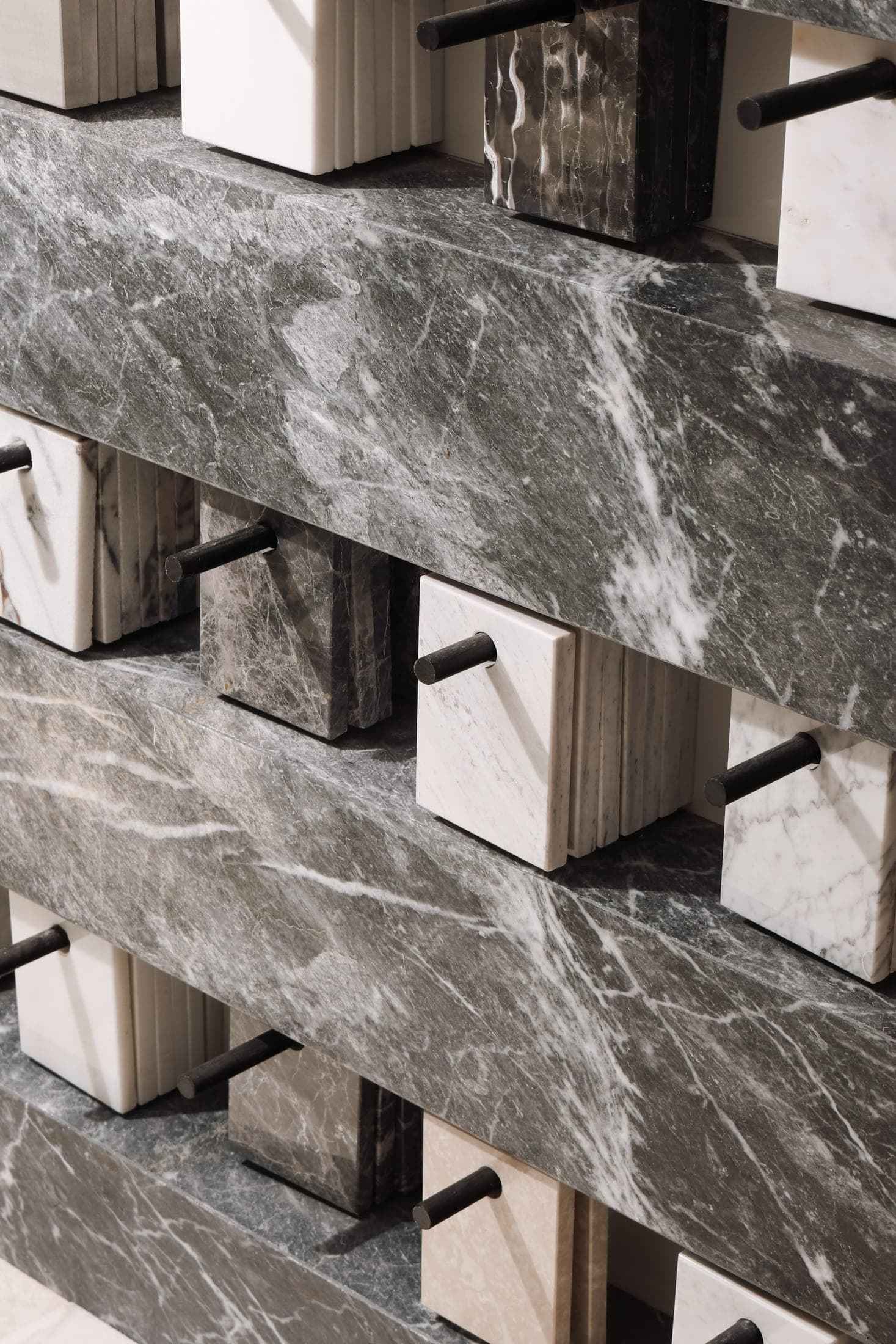 Green marble samples racked on the Zein Group sample wall